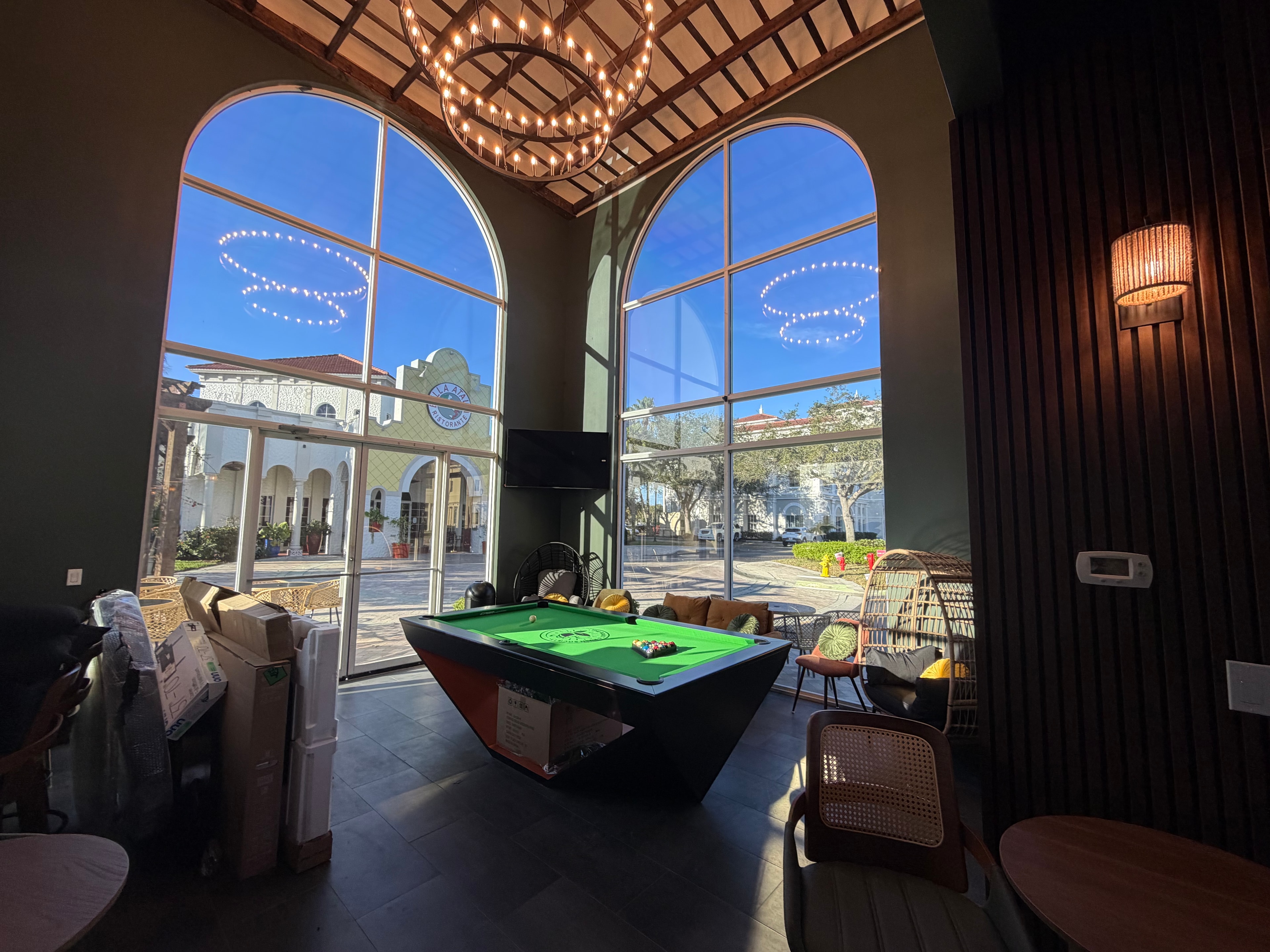 Coffee shop arched windows and pool table
