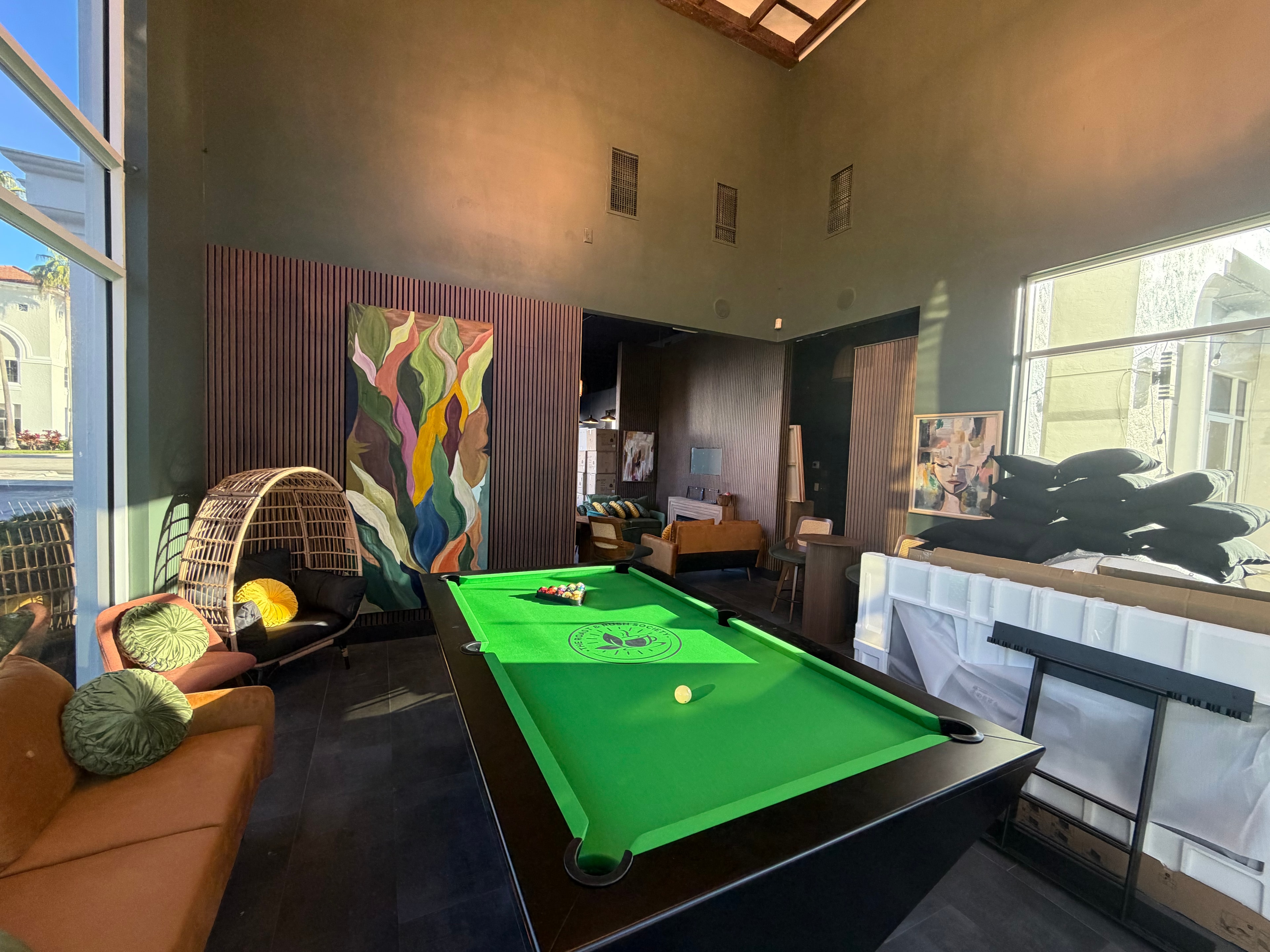 Coffee shop lounge with pool table and artwork