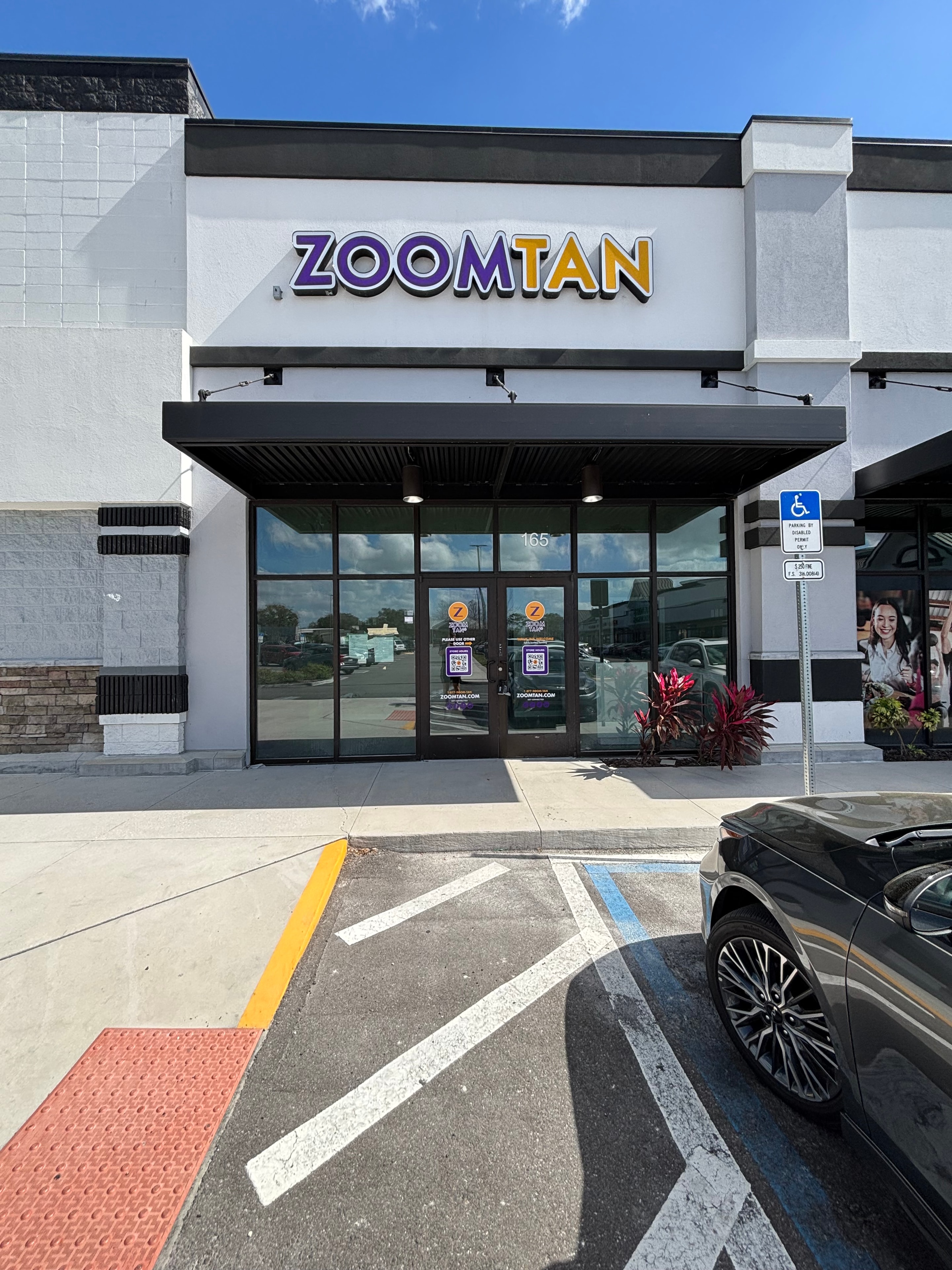 Zoom Tan storefront exterior